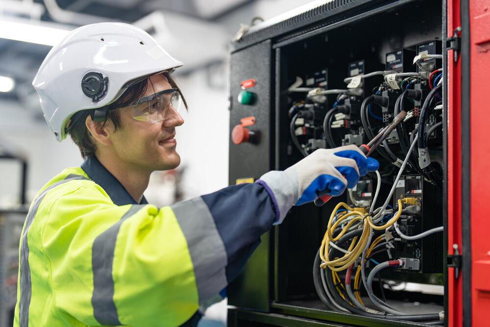 An engineer testing wiring