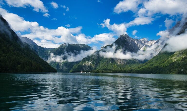 A lake with mountains in the background