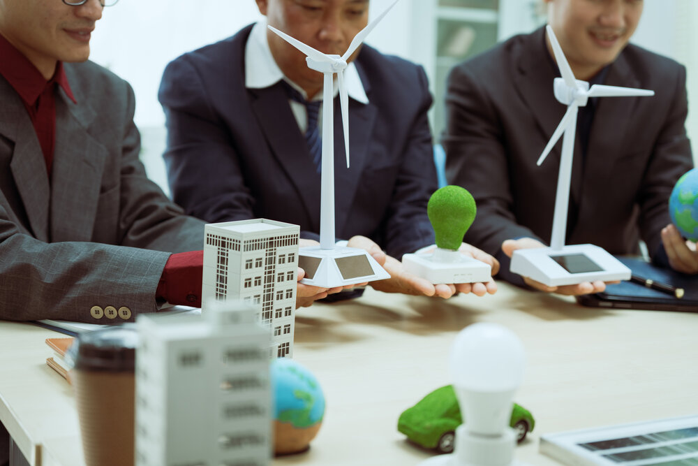 Three businessmen meeting to discuss sustainability