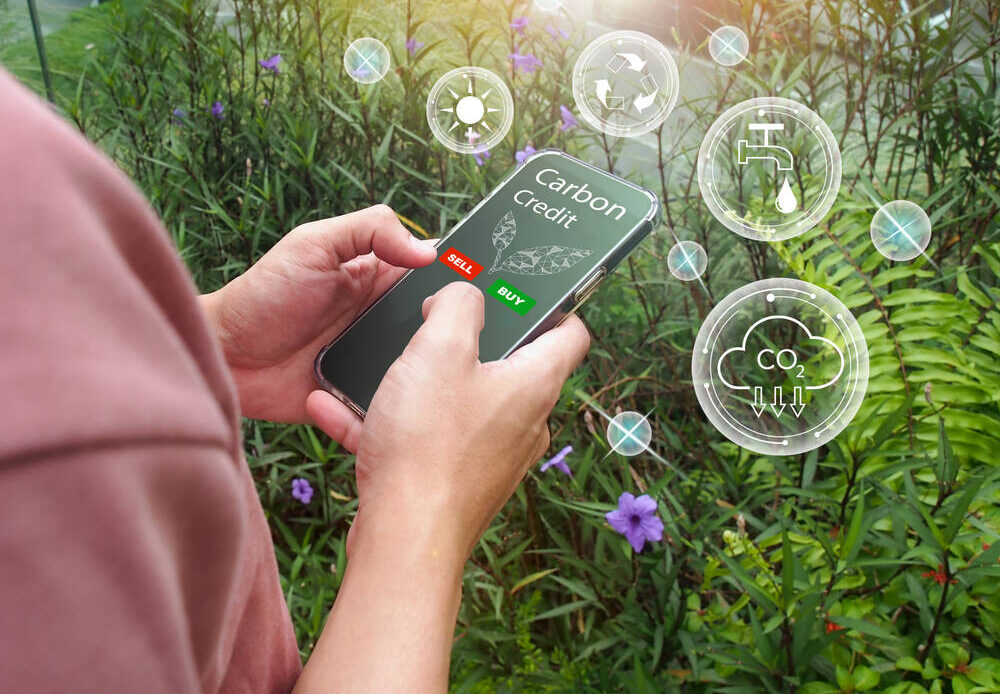 A man buying carbon credits on a smartphone