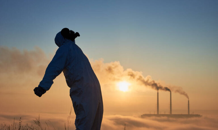 Side view of scientist in gas mask