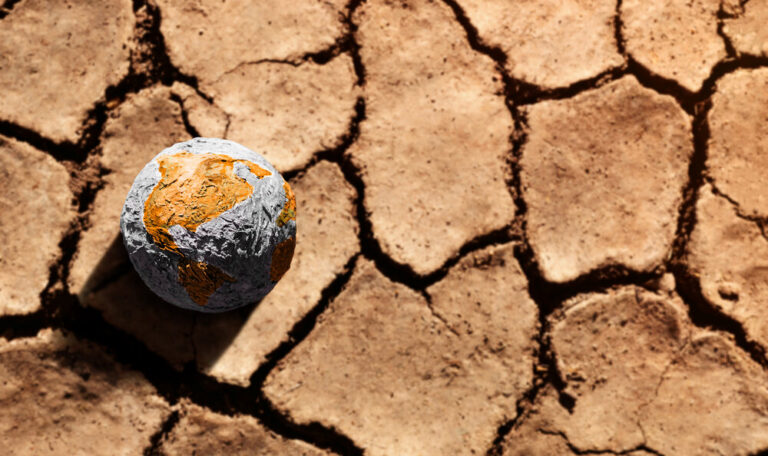 A globe on dry earth