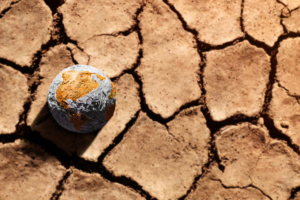 A globe on dry earth