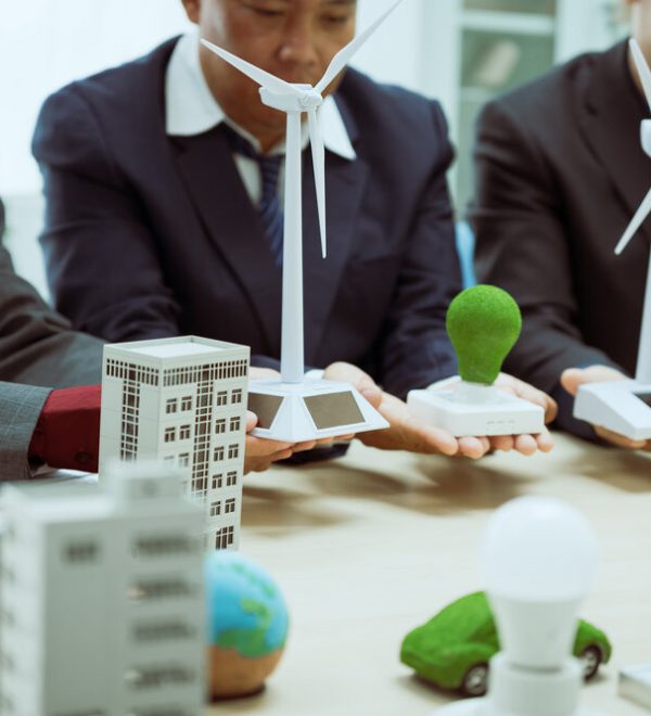 Three businessmen meeting to discuss sustainability